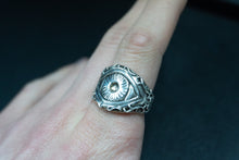 Load image into Gallery viewer, far back shot of a sterling silver ring of the eye of polyphemus the greek cyclops on finger