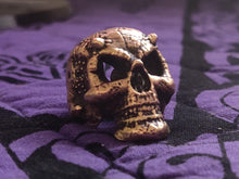 Load image into Gallery viewer, devil skull ring bronze on purple fabric