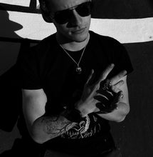 Load image into Gallery viewer, cool guy wearing poseidon skull ring black and white
