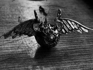 kings of alchemy valkyrie pendant black and white close up on table