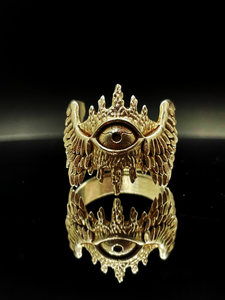 a gold hypnos of lemnos god of sleep ring on dark table